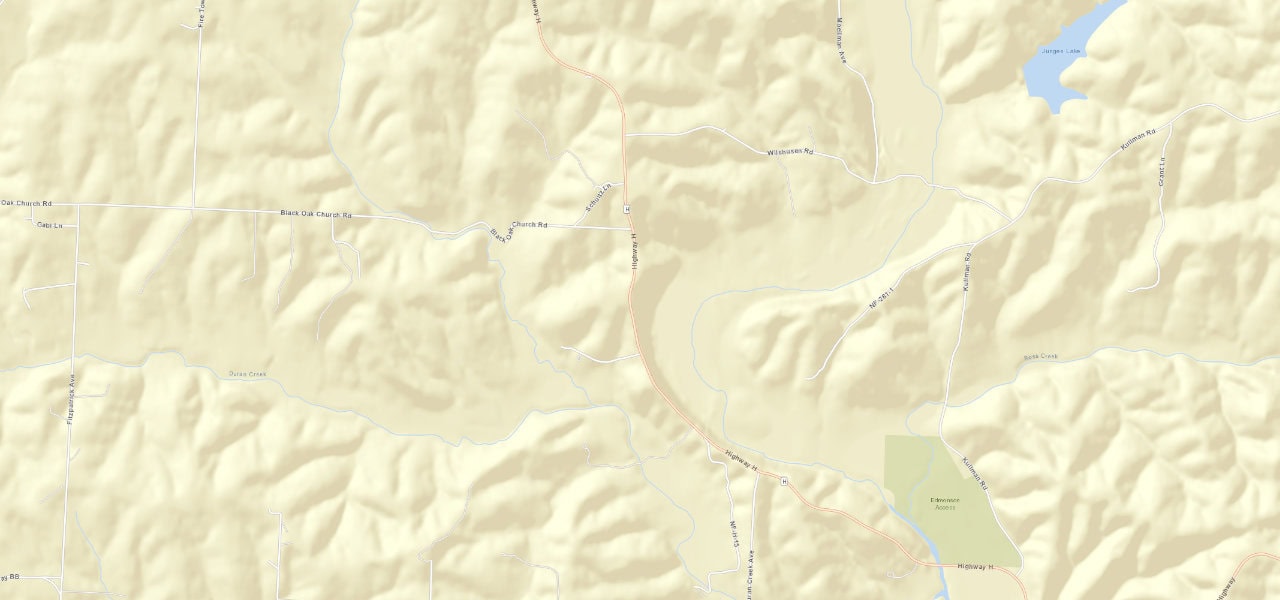Wider street view of Route H south of Black Oak Church Road