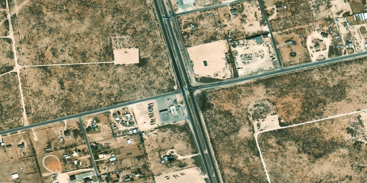 Satellite imagery of the US 385 and West Apple Street intersection in Ector County, Texas