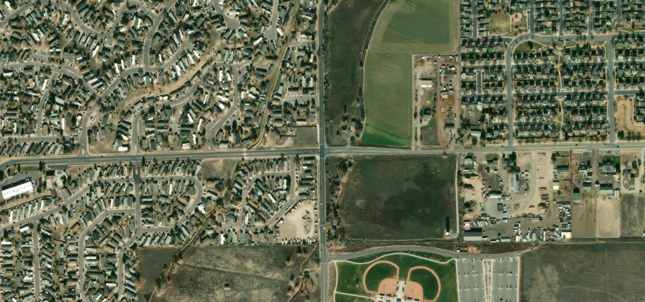 Satellite view of the East 100th Avenue and Riverdale Road vicinity in Thornton, Colorado; no exact collision point marked.